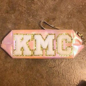 Monogrammed Judith March makeup bag. “KMC” Pink iridescent w/ white lettering.